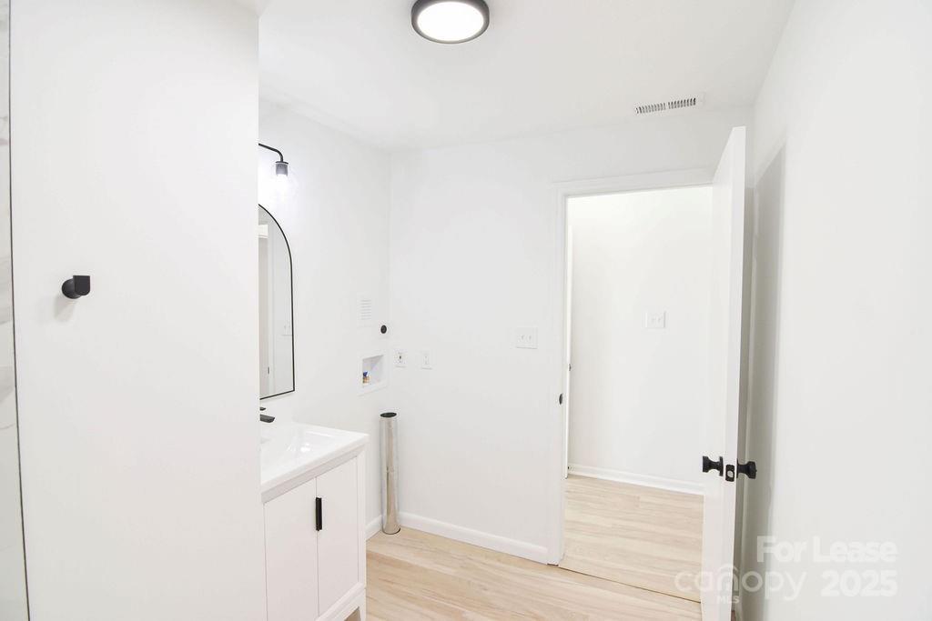 520 Denver Street Kannapolis, NC 28083 - Photo 11 of 14 a bathroom with a sink and a mirror