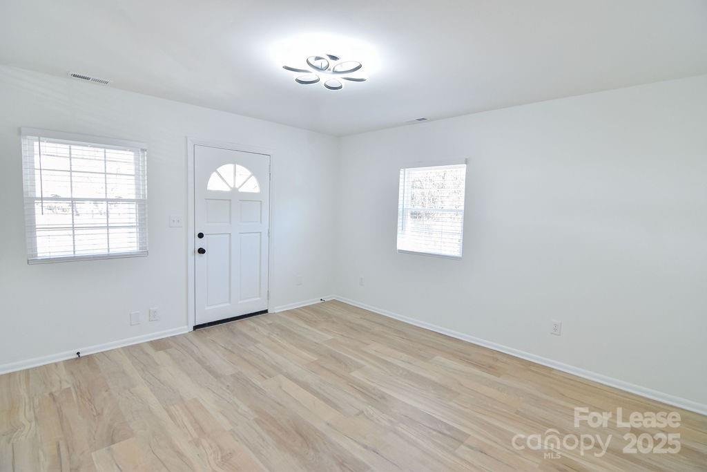 520 Denver Street Kannapolis, NC 28083 - Photo 2 of 14 an empty room with windows and closet