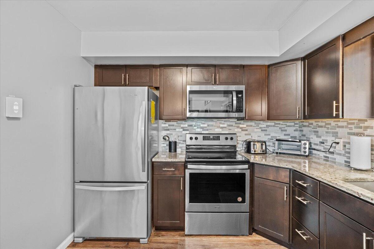 52 Hickory Road Lake Harmony, PA 18624 - Photo 13 of 36 a kitchen with a refrigerator sink and microwave