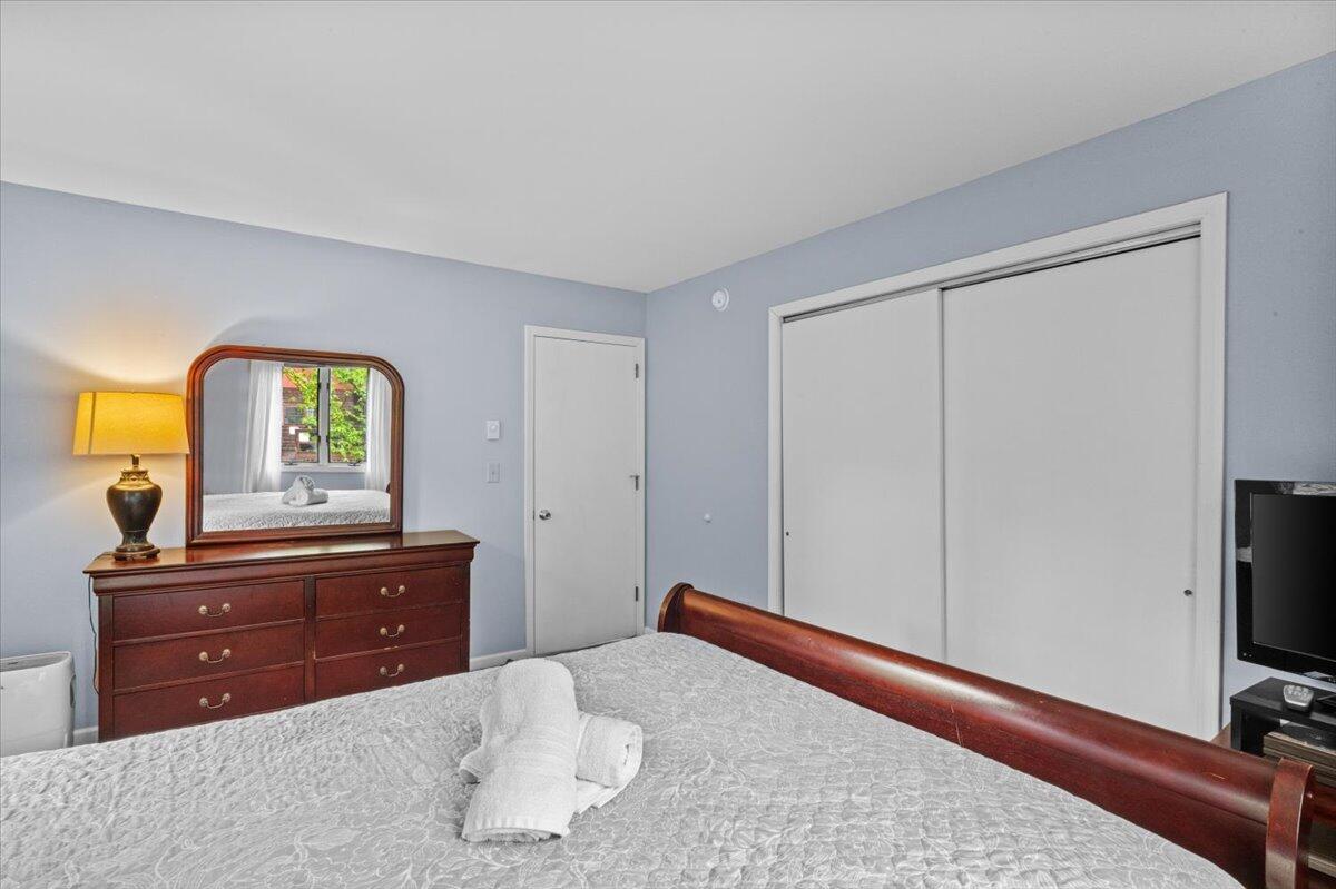 52 Hickory Road Lake Harmony, PA 18624 - Photo 19 of 36 a bedroom with a bed and a flat tv screen on dresser