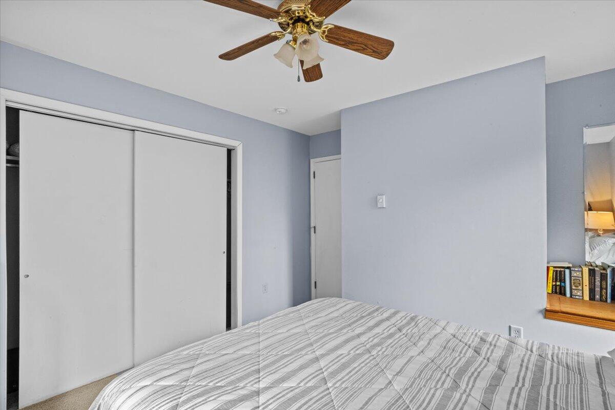 52 Hickory Road Lake Harmony, PA 18624 - Photo 21 of 36 a bedroom with a bed and a chandelier