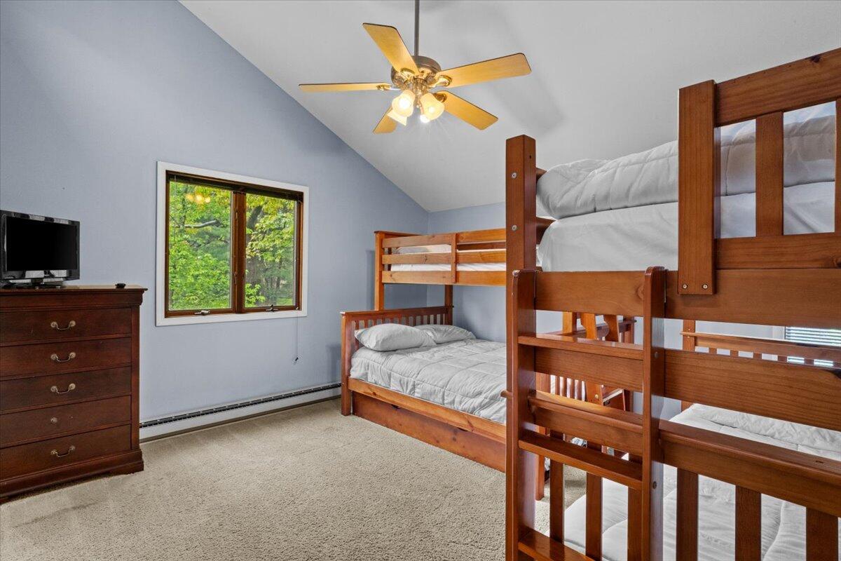 52 Hickory Road Lake Harmony, PA 18624 - Photo 23 of 36 a bedroom with a bed and a window