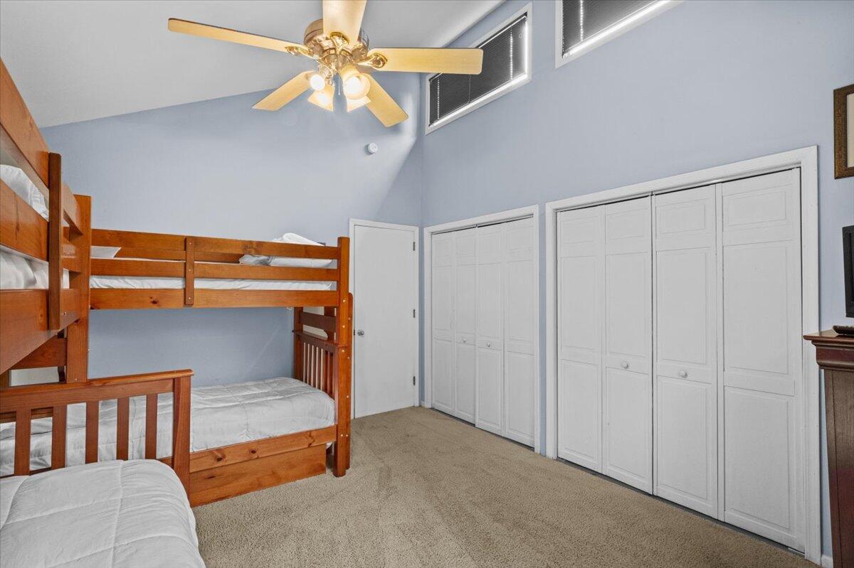 52 Hickory Road Lake Harmony, PA 18624 - Photo 24 of 36 a bedroom with a bed and a chandelier