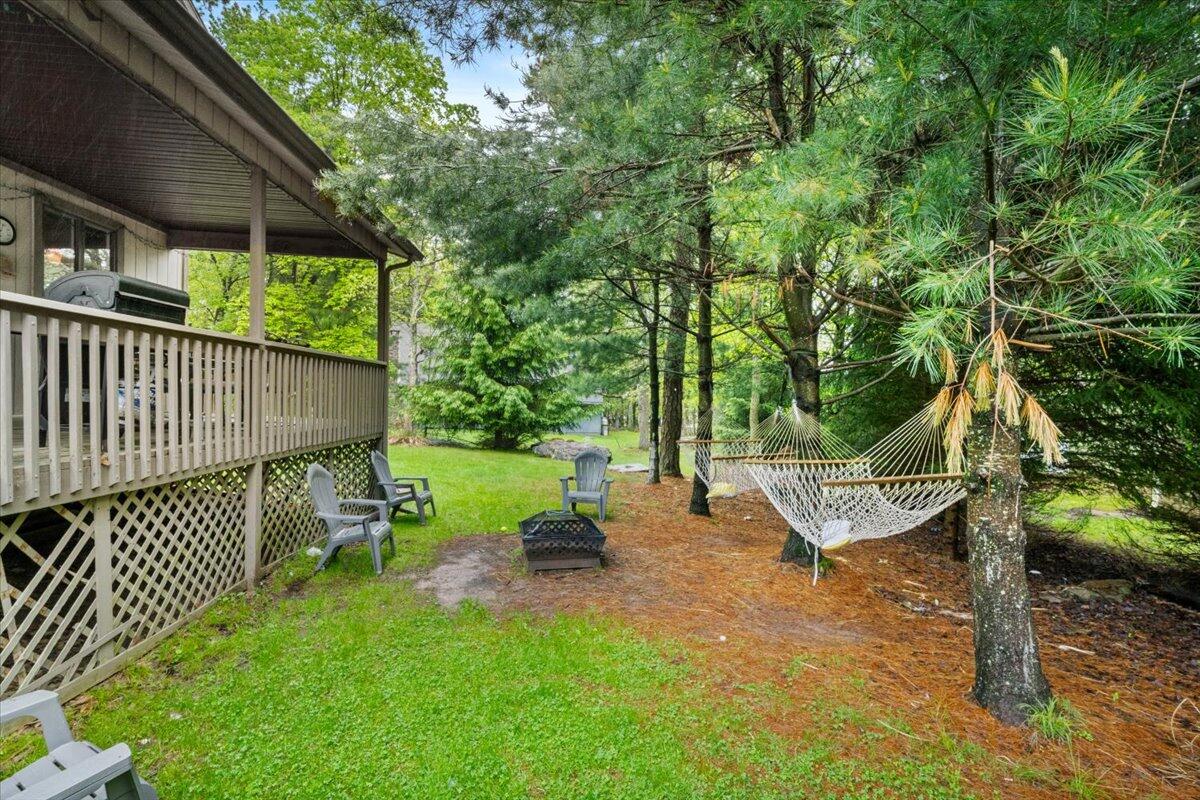 52 Hickory Road Lake Harmony, PA 18624 - Photo 25 of 36 a view of a bench in a backyard