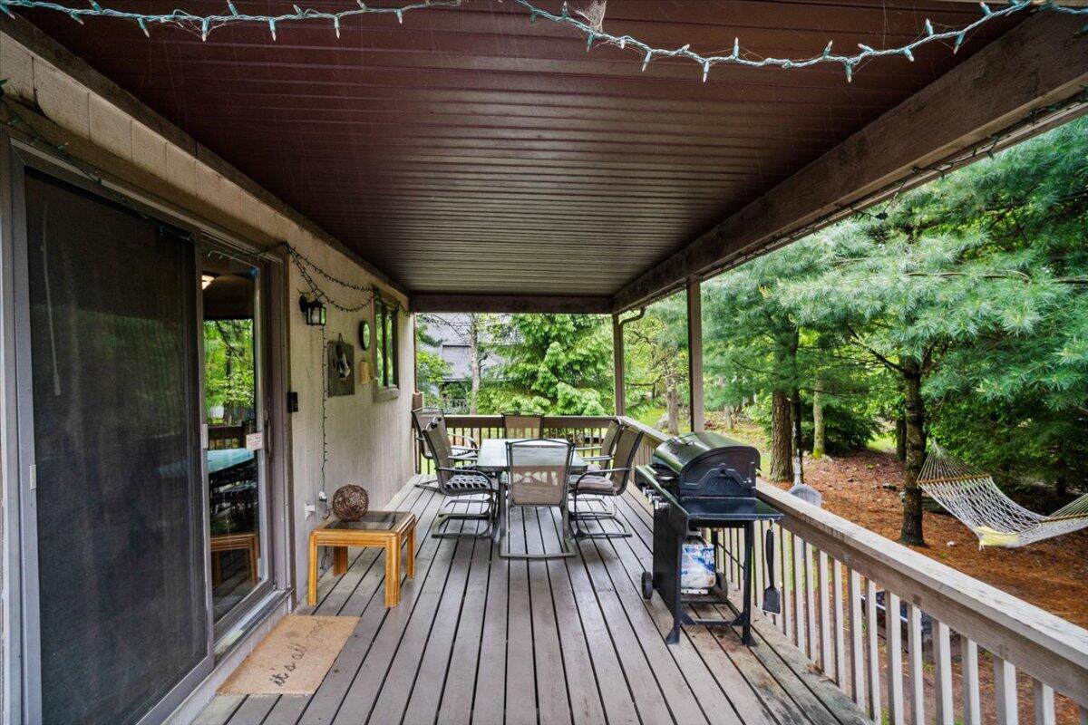 52 Hickory Road Lake Harmony, PA 18624 - Photo 27 of 36 a view of balcony with chairs and wooden fence