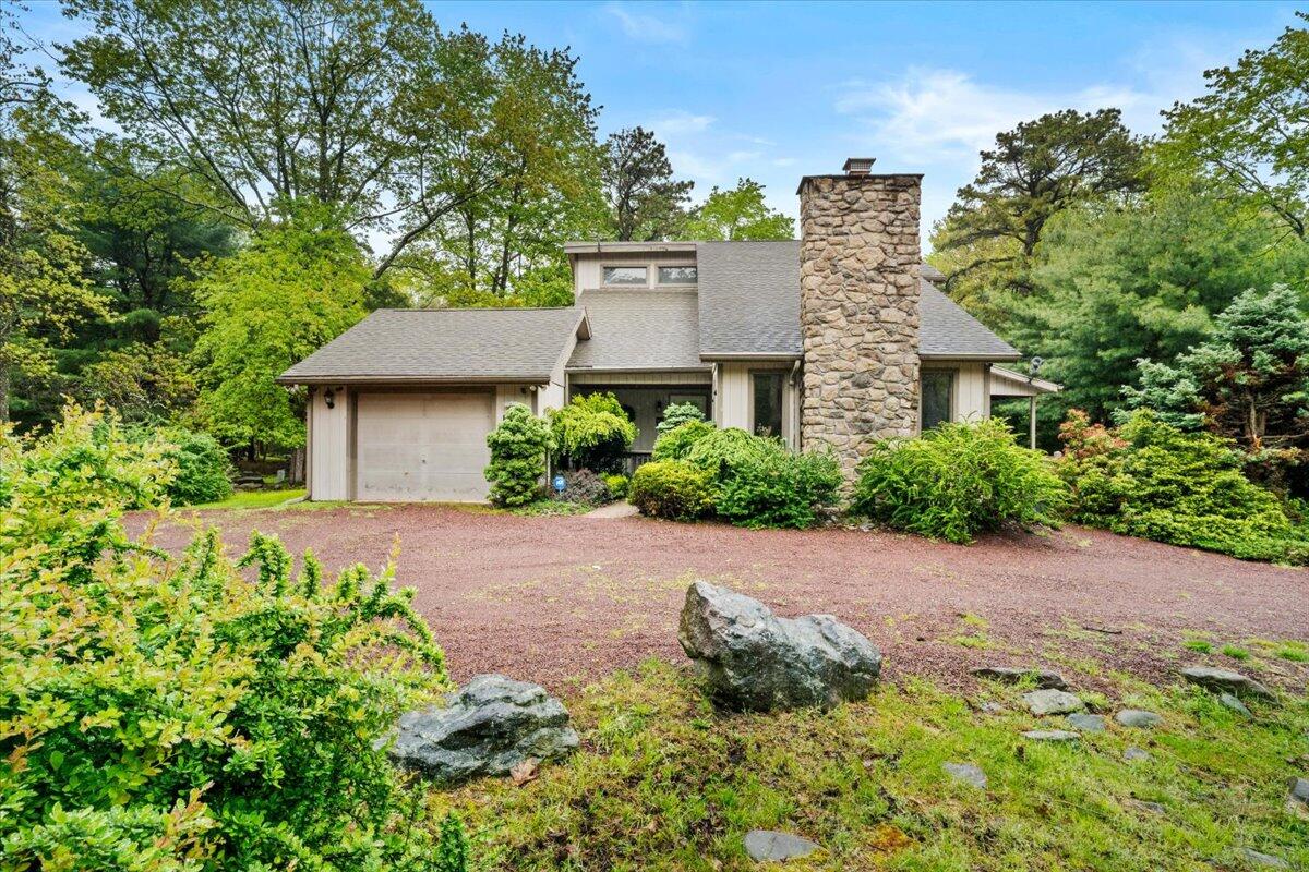 52 Hickory Road Lake Harmony, PA 18624 - Photo 3 of 36 a aerial view of a house with a yard and potted plants