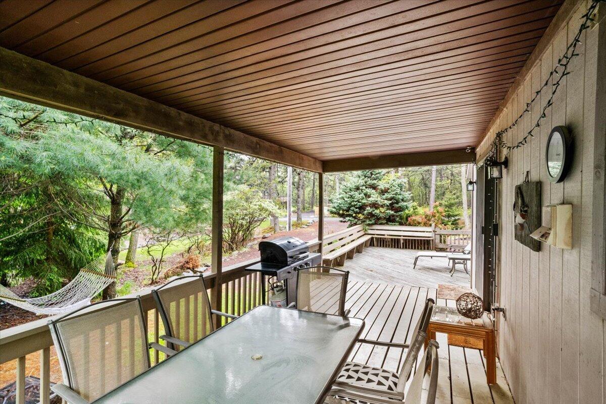 52 Hickory Road Lake Harmony, PA 18624 - Photo 5 of 36 a view of a porch with wooden floor