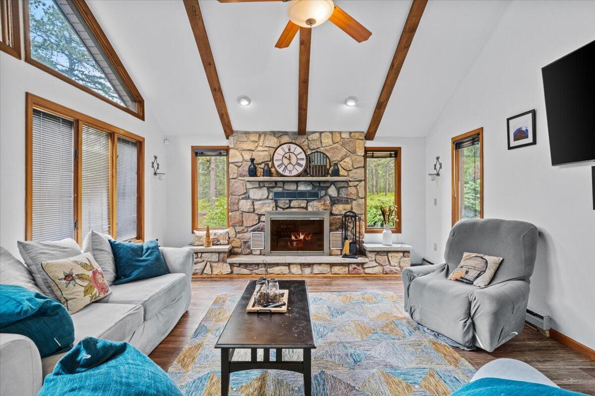 52 Hickory Road Lake Harmony, PA 18624 - Photo 7 of 36 a living room with furniture a fireplace and a flat screen tv