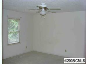 27038 Tidal Way, Unit C Tega Cay, SC 29708 - Photo 8 of 8 a view of a small space with a window and a ceiling fan