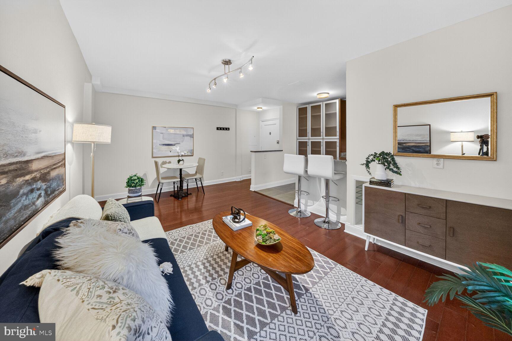 2339 40th Place Northwest, Unit 101 Washington, DC 20007 - Photo 4 of 12 a living room with furniture and wooden floor