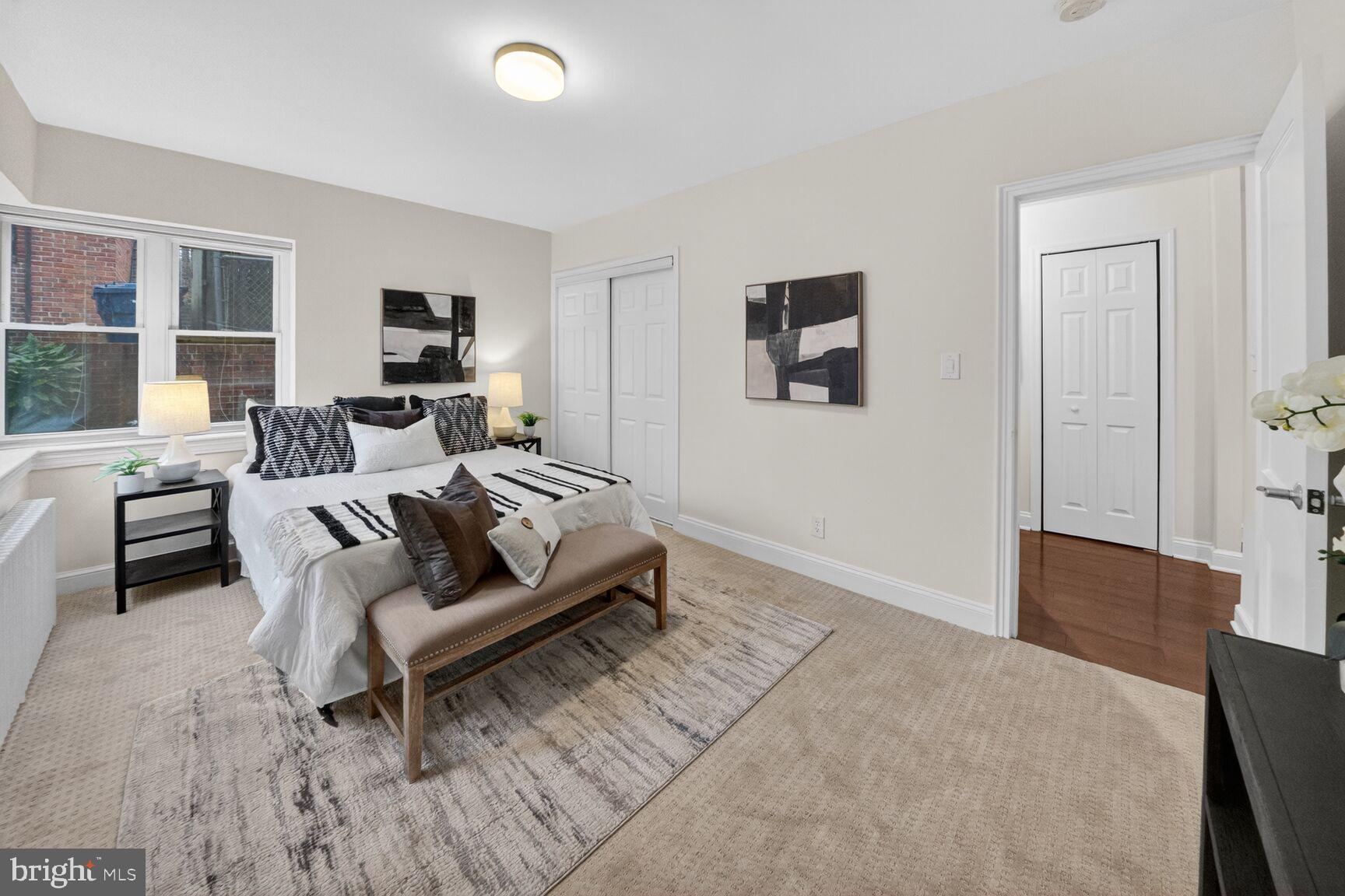 2339 40th Place Northwest, Unit 101 Washington, DC 20007 - Photo 10 of 12 a living room with furniture and a flat screen tv