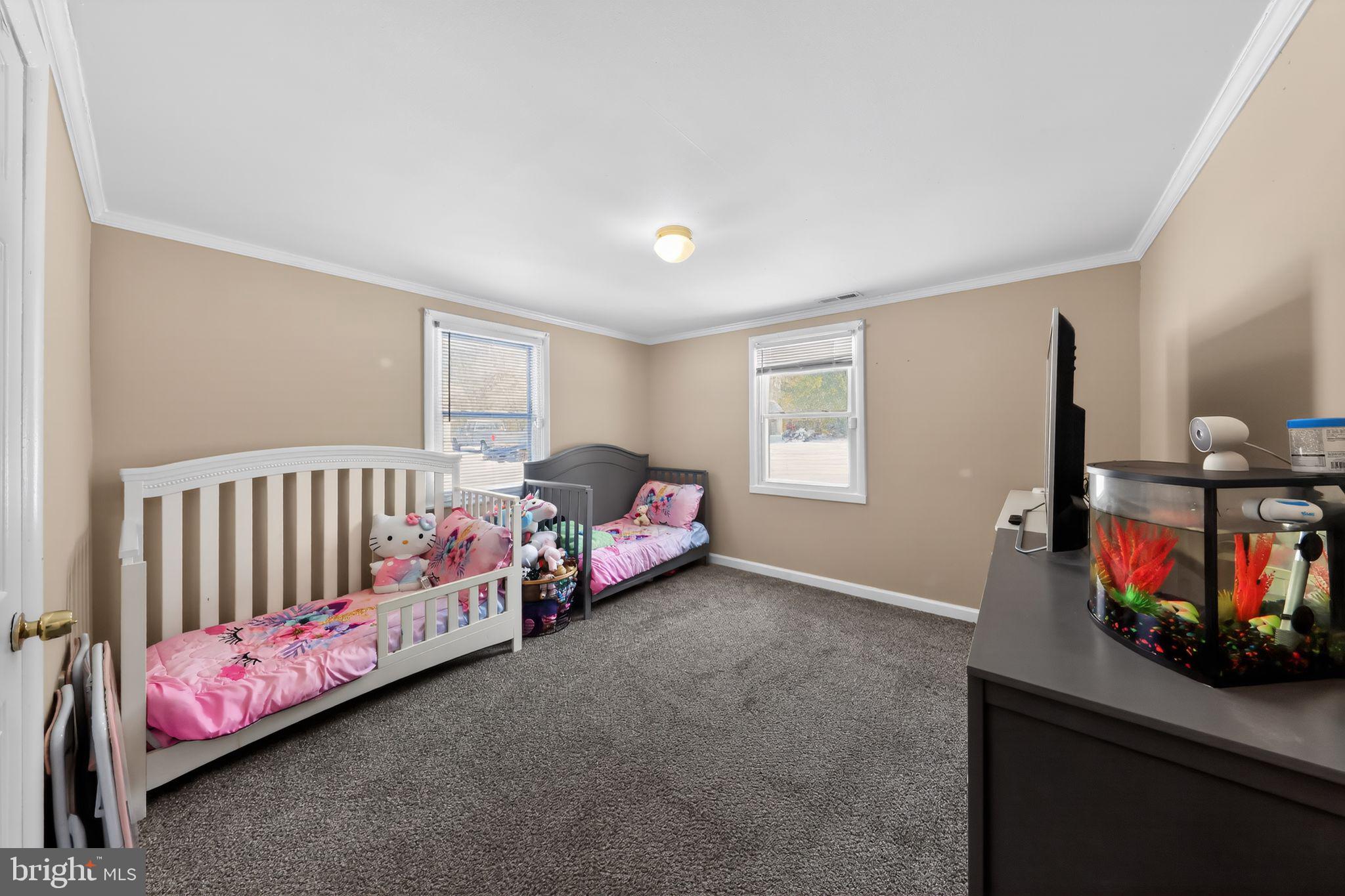 14857 Oakland Road Ridgely, MD 21660 - Photo 11 of 14 a bedroom with furniture and a window