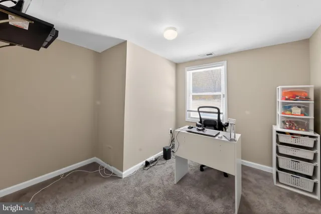 a view of a workspace with furniture