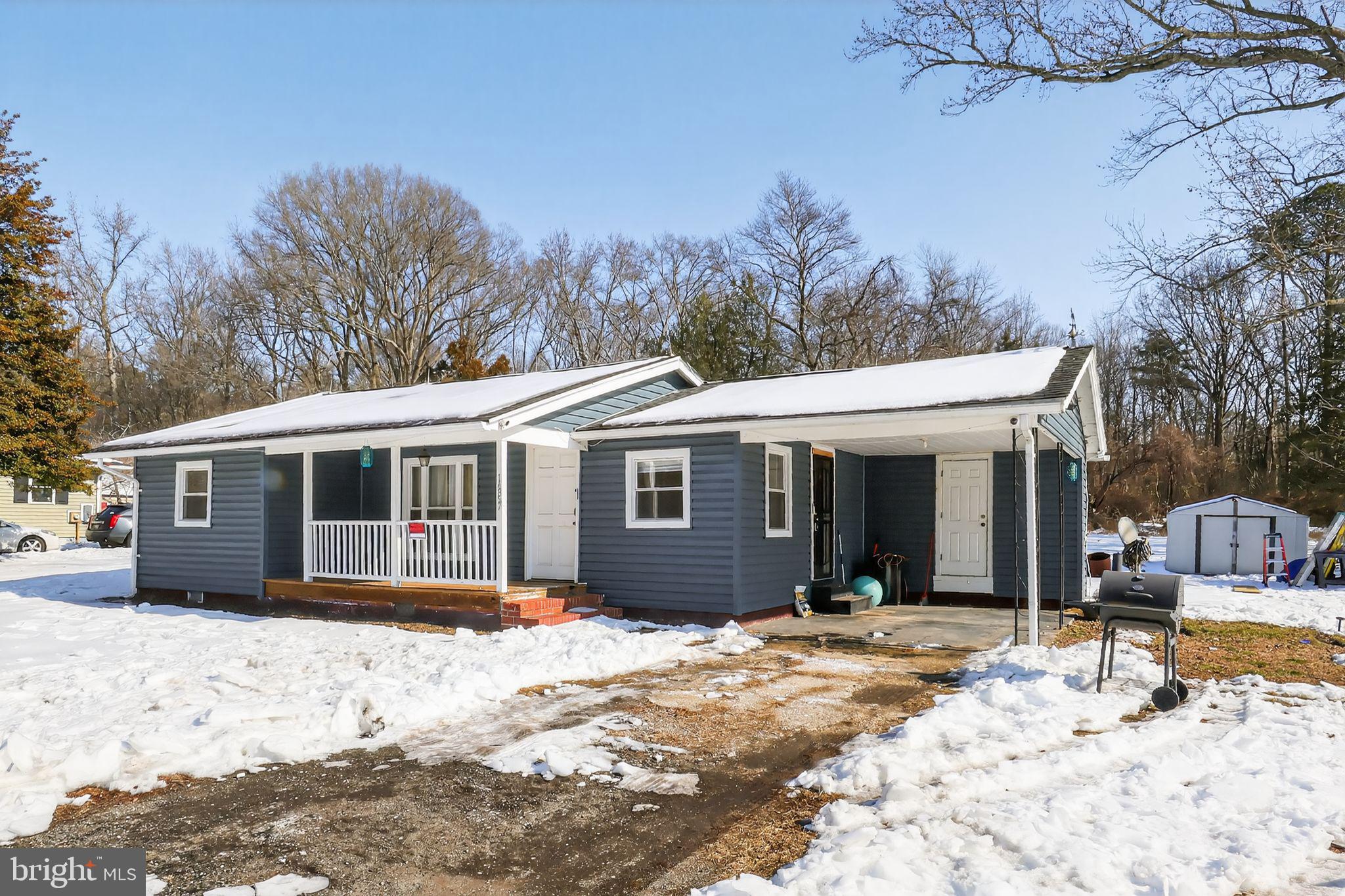 14857 Oakland Road Ridgely, MD 21660 - Photo 5 of 14 a view of a house with snow on the road