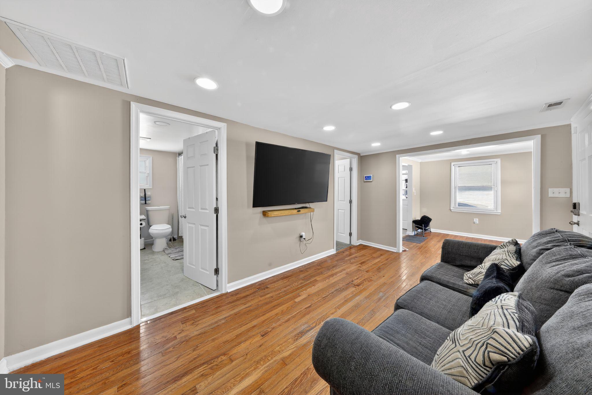 14857 Oakland Road Ridgely, MD 21660 - Photo 6 of 14 a living room with furniture and a flat screen tv