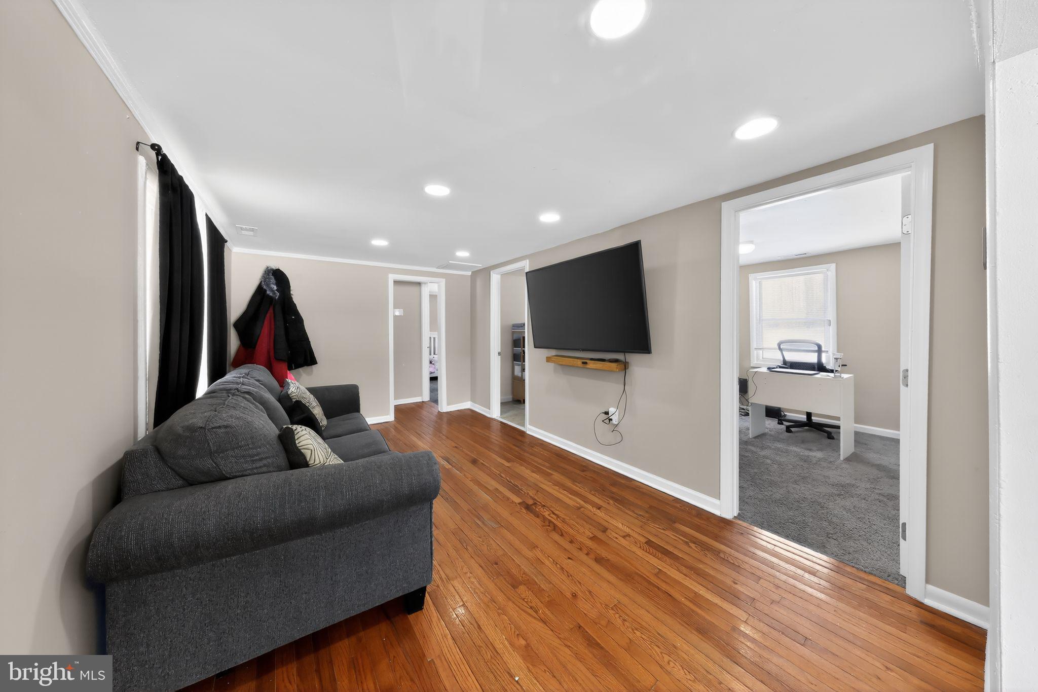 14857 Oakland Road Ridgely, MD 21660 - Photo 7 of 14 a living room with furniture and a flat screen tv