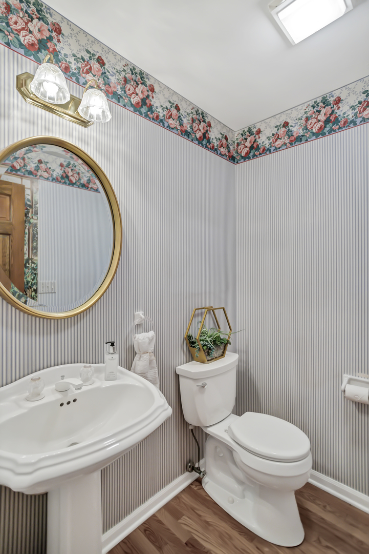 3 Hampton Court DeKalb, IL 60115 - Photo 15 of 35 a white toilet sitting next to a bathroom sink
