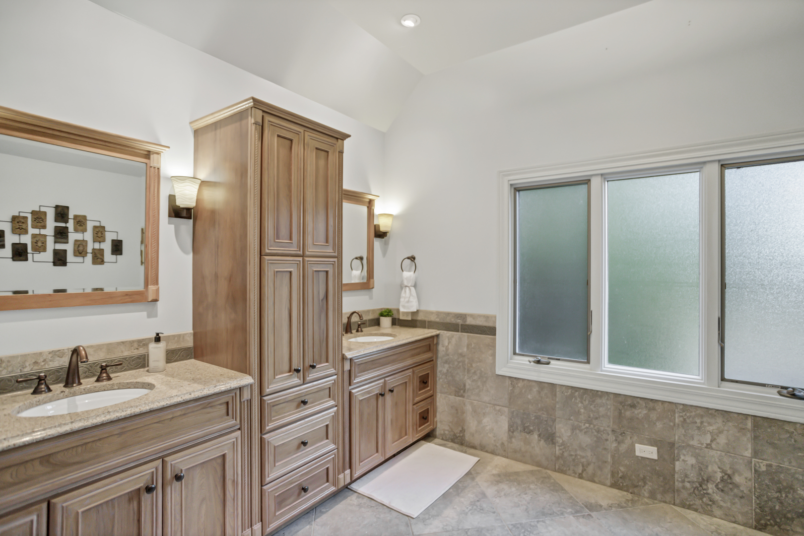 3 Hampton Court DeKalb, IL 60115 - Photo 17 of 35 a spacious bathroom with a granite countertop sink mirror and double