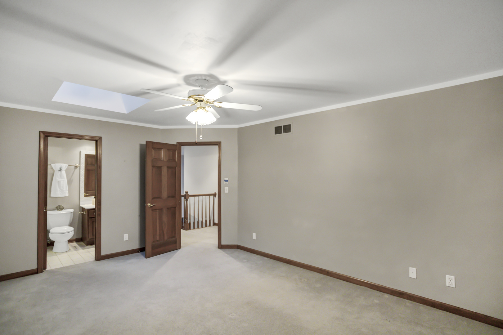 3 Hampton Court DeKalb, IL 60115 - Photo 22 of 35 an empty room with a ceiling fan and bathroom