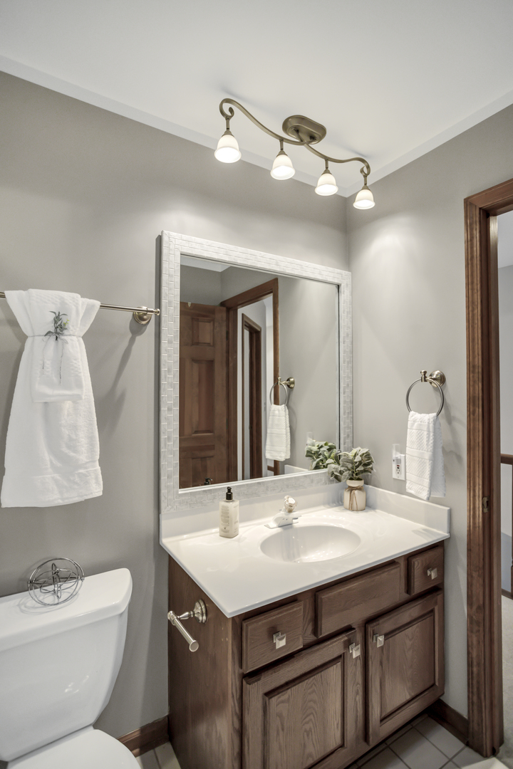 3 Hampton Court DeKalb, IL 60115 - Photo 23 of 35 a bathroom with a toilet sink and mirror