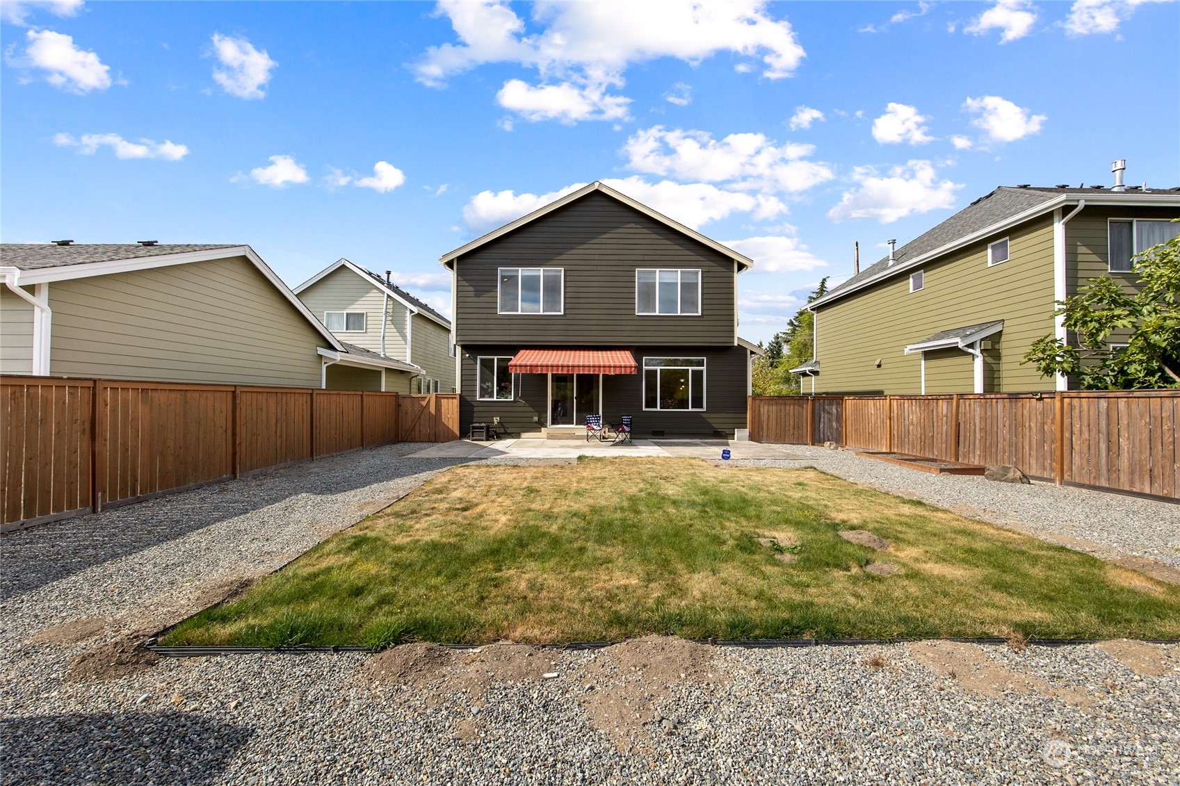 1910 Talbot Road South Renton, WA 98055 - Photo 23 of 26 a front view of a house with a yard and garage