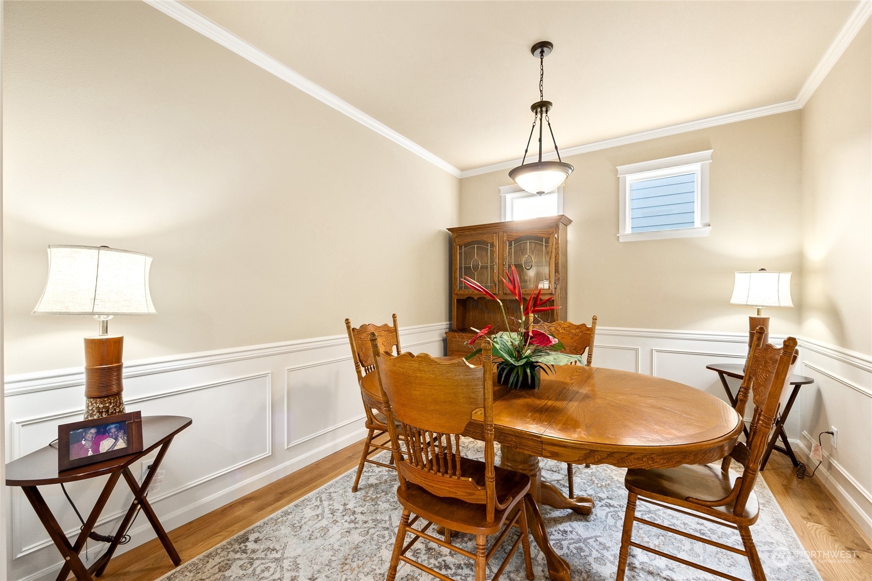 1910 Talbot Road South Renton, WA 98055 - Photo 6 of 26 a view of a dining room with furniture and wooden floor