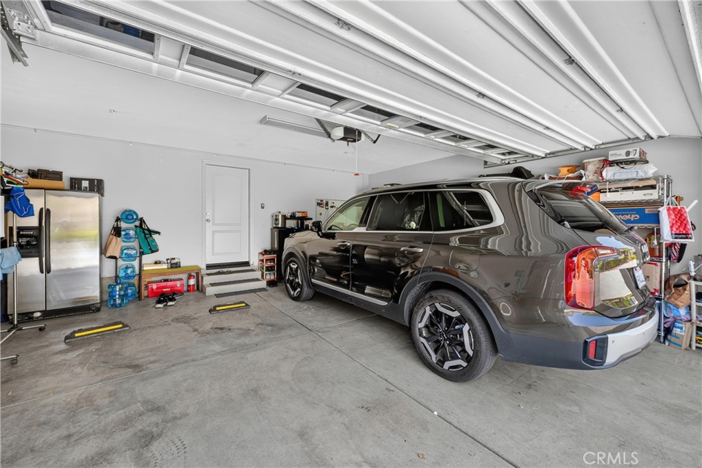 849 The Promenade, Unit D Azusa, CA 91702 - Photo 31 of 37 a view of parking garage with cars