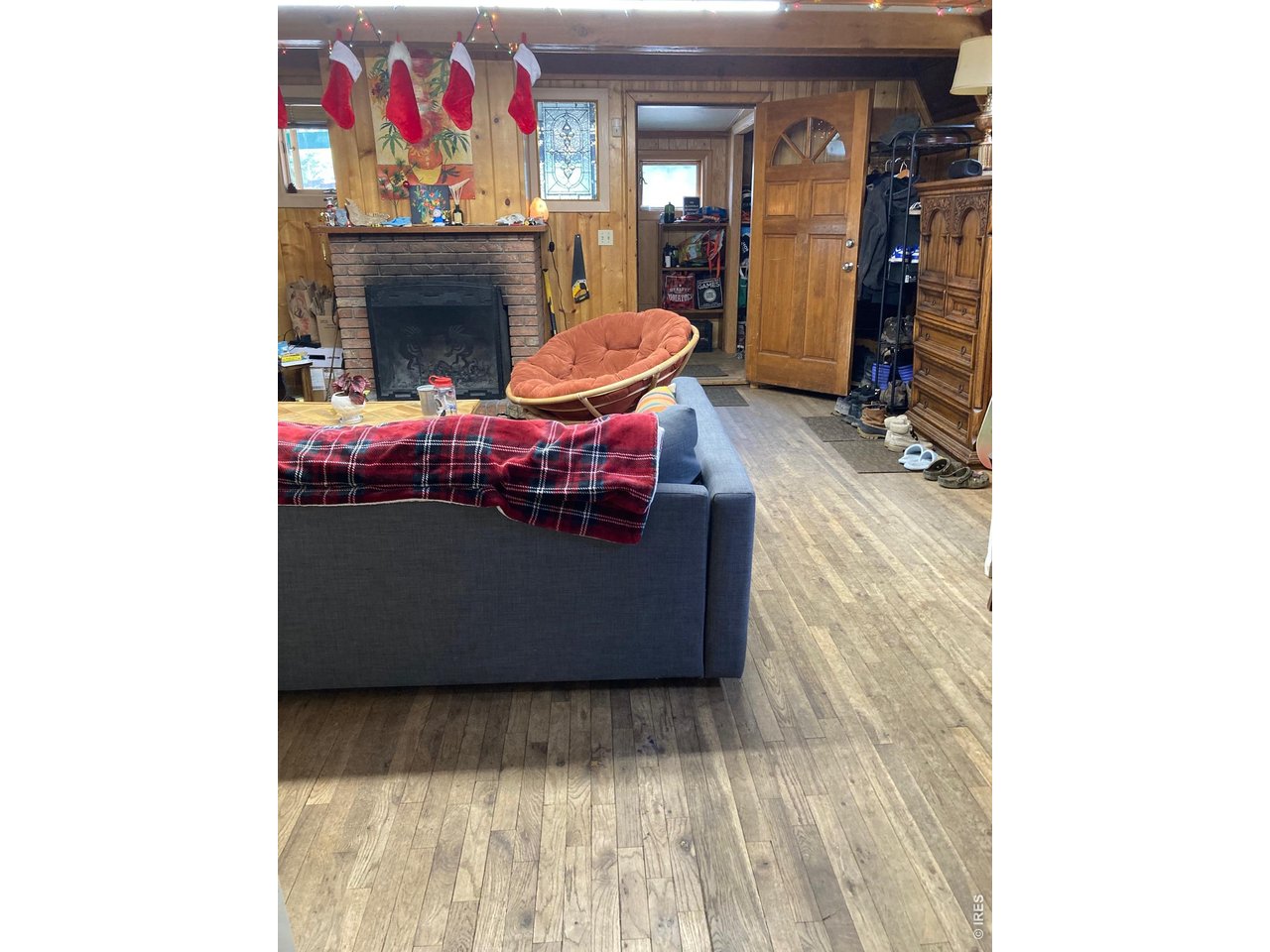 1064 Cold Springs Road Nederland, CO 80466 - Photo 27 of 48 a room with furniture and a fireplace