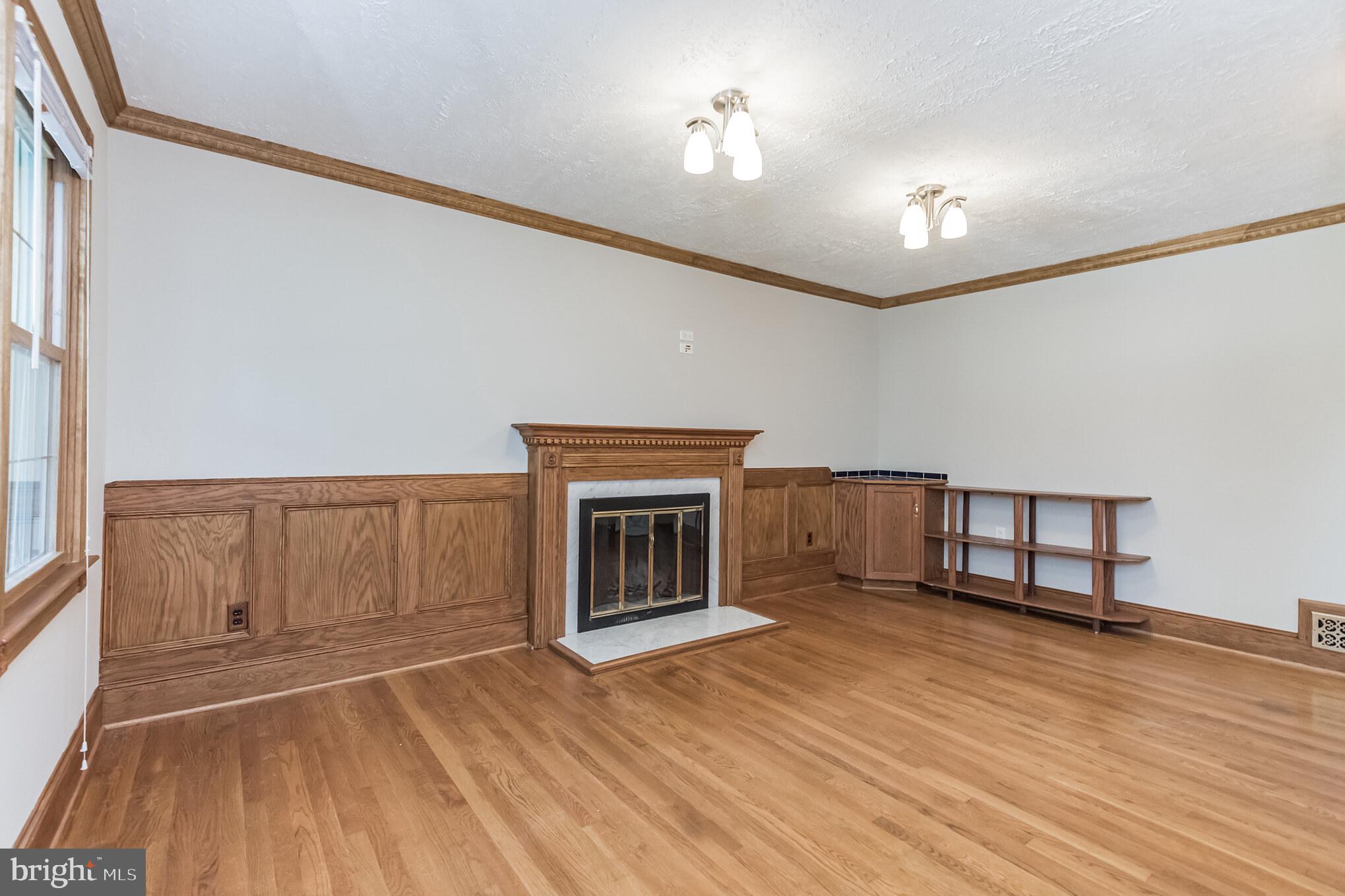 2124 Drury Road Silver Spring, MD 20906 - Photo 12 of 29 Family room with custom paneling and bookshelves