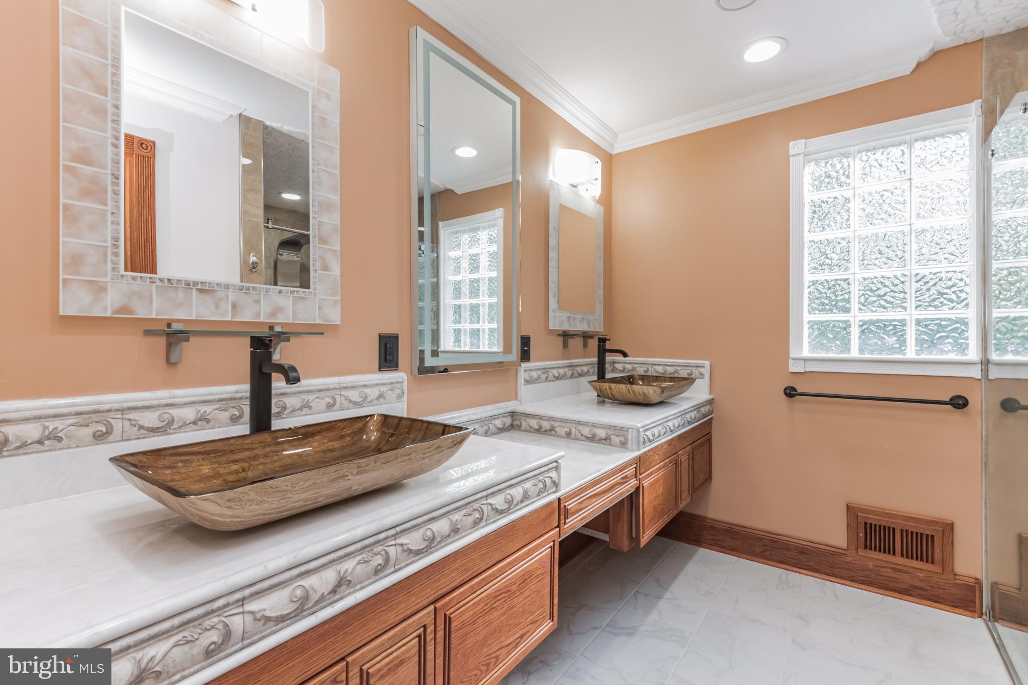 2124 Drury Road Silver Spring, MD 20906 - Photo 17 of 29 Owner's bathroom showing dual sink vanity