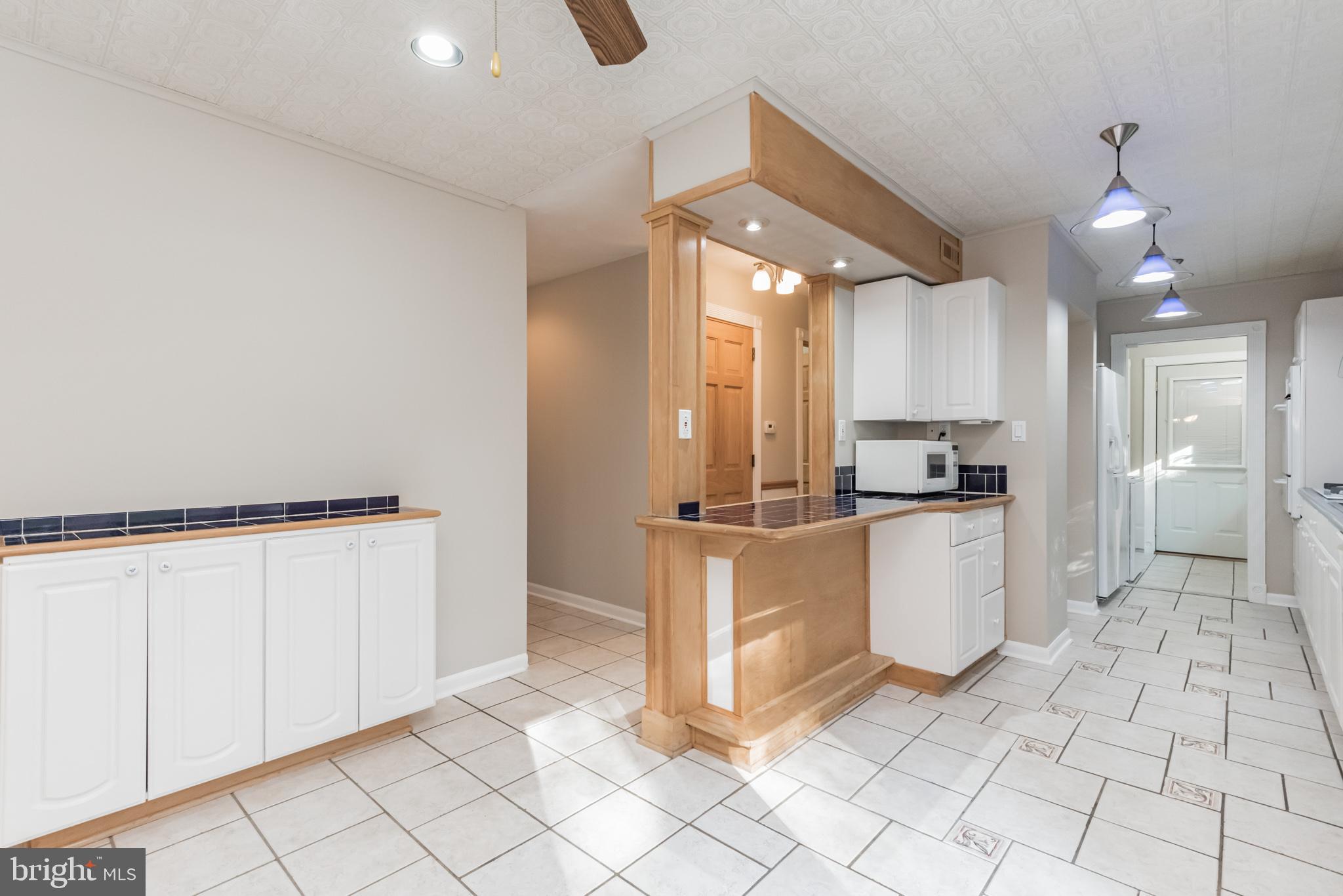 2124 Drury Road Silver Spring, MD 20906 - Photo 6 of 29 Kitchen showing breakfast bar and extra cabinetry