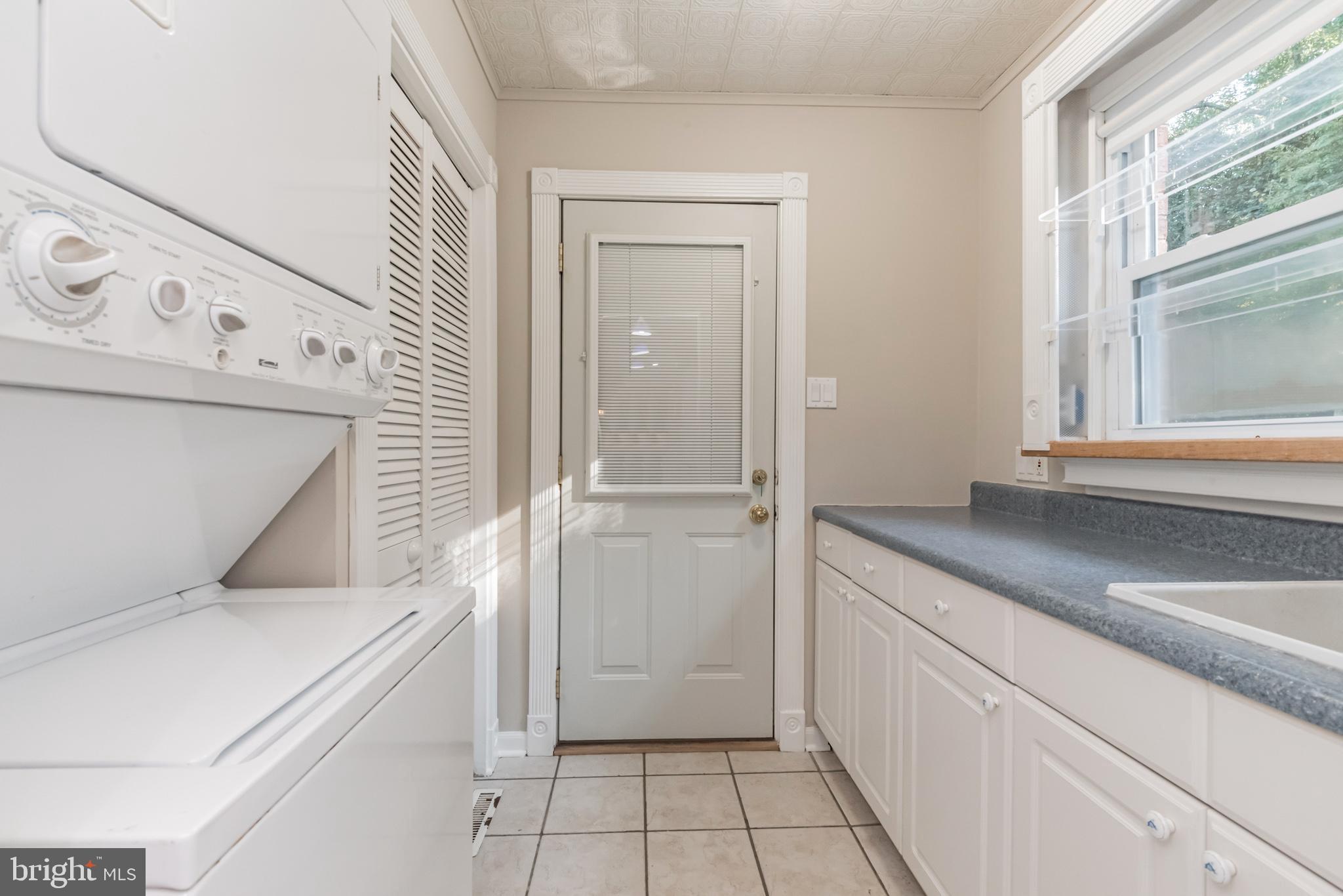 2124 Drury Road Silver Spring, MD 20906 - Photo 7 of 29 Laundry with pantry, cabinetry and sink