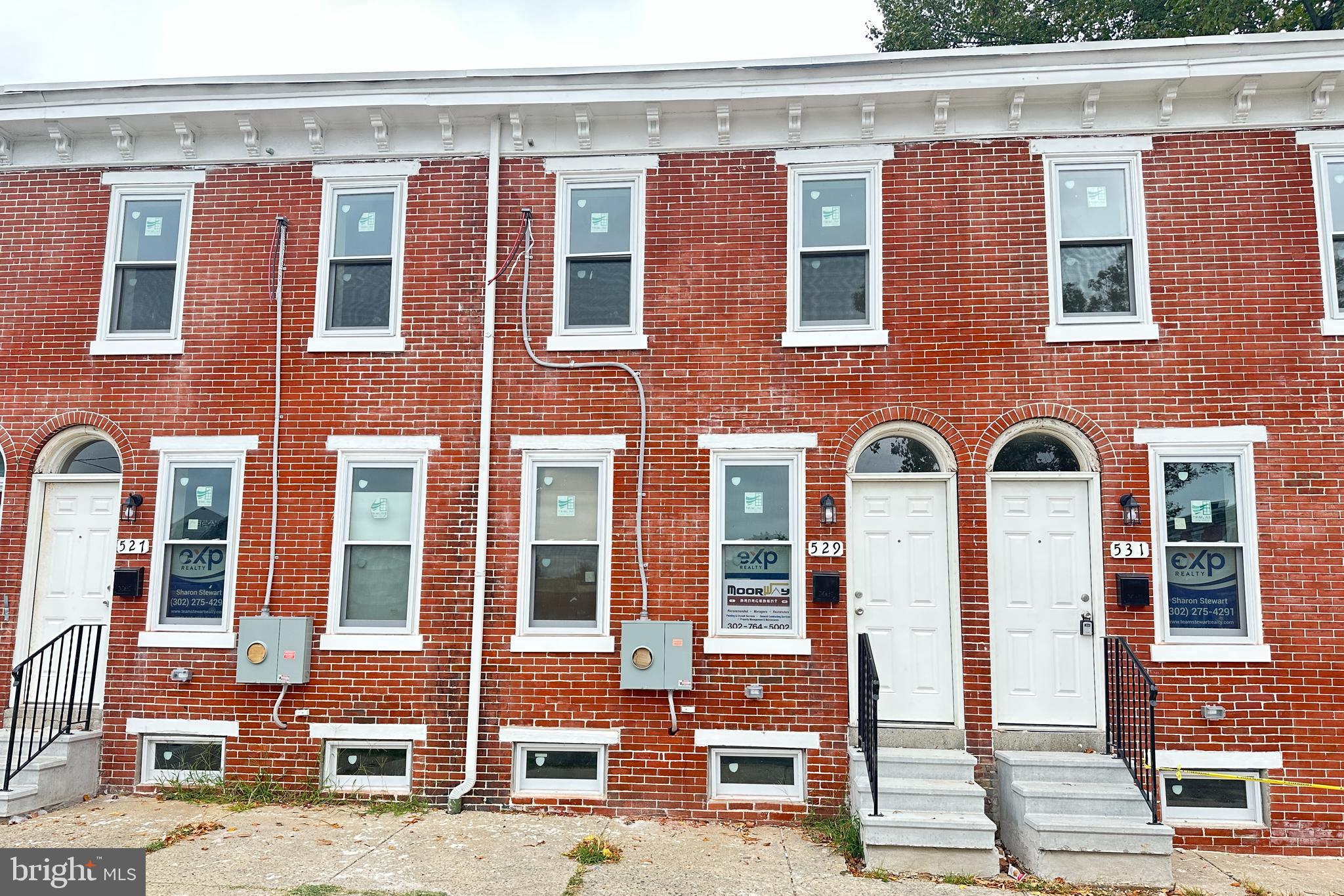 527 East 8th Street Wilmington, DE 19801 - Photo 1 of 4 a front view of a building with glass windows