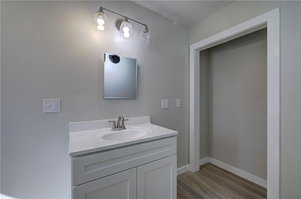 76 Morning Dew Lane Clayton, GA 30525 - Photo 11 of 28 a bathroom with a sink and a mirror