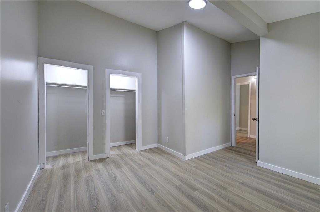 76 Morning Dew Lane Clayton, GA 30525 - Photo 14 of 28 an empty room with wooden floor and closet