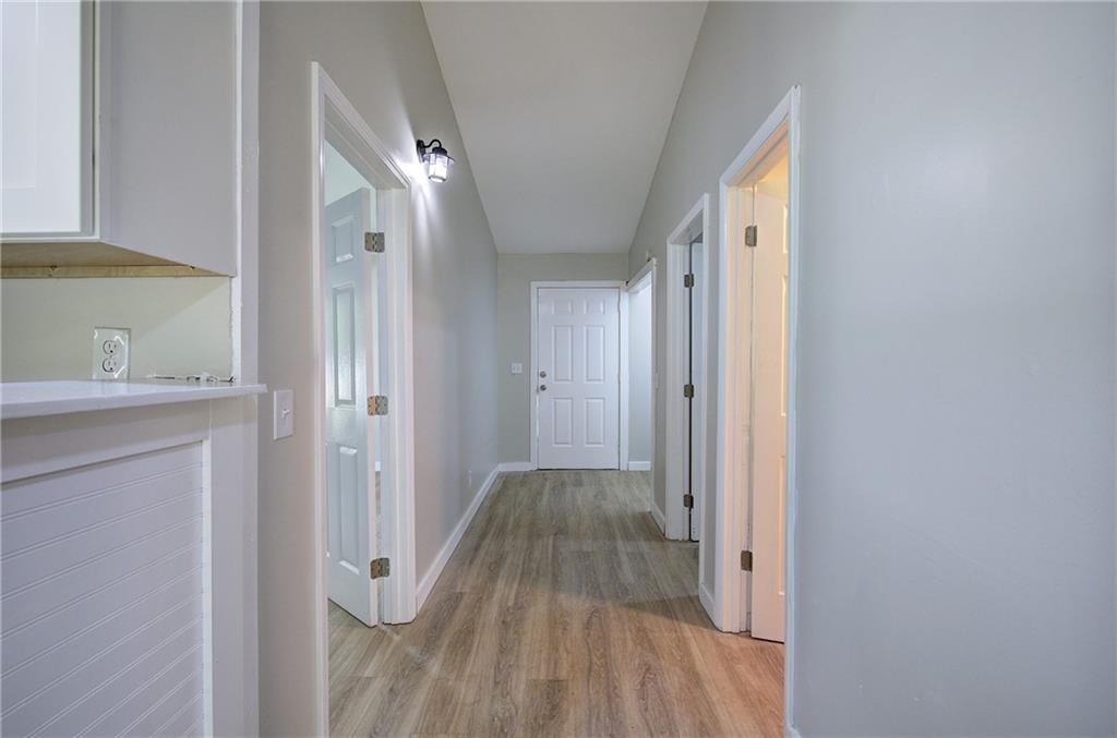 76 Morning Dew Lane Clayton, GA 30525 - Photo 18 of 28 a view of a hallway with wooden floor and closet area