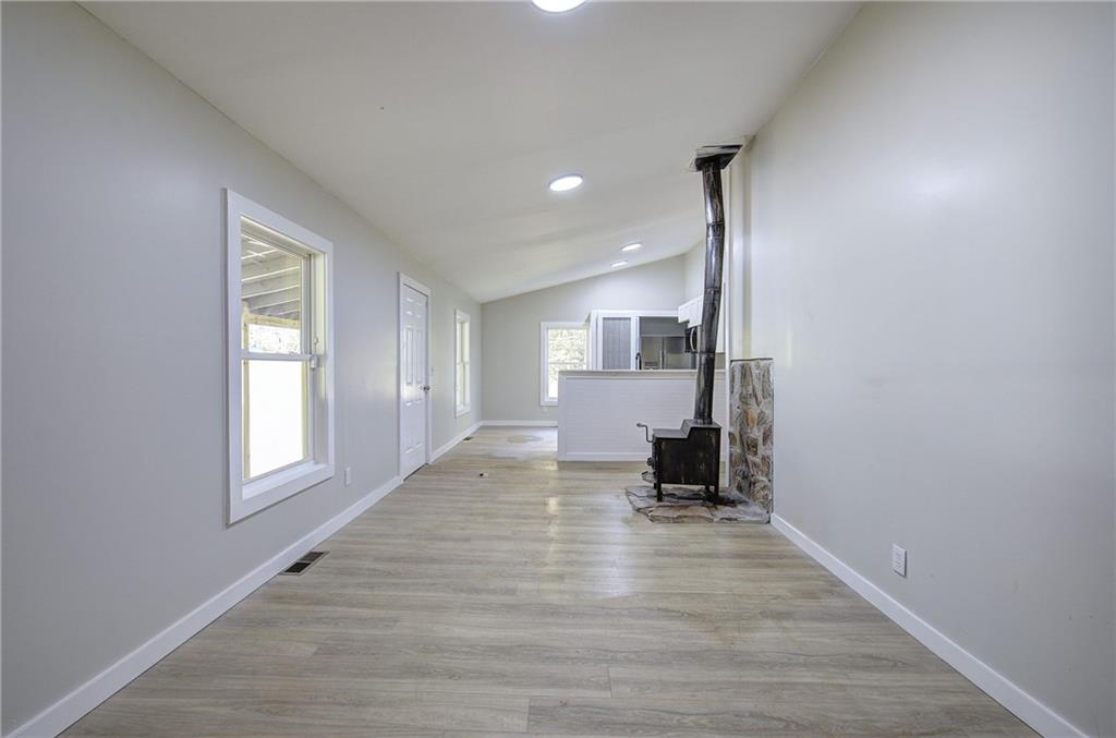 76 Morning Dew Lane Clayton, GA 30525 - Photo 20 of 28 a view of empty room with wooden floor
