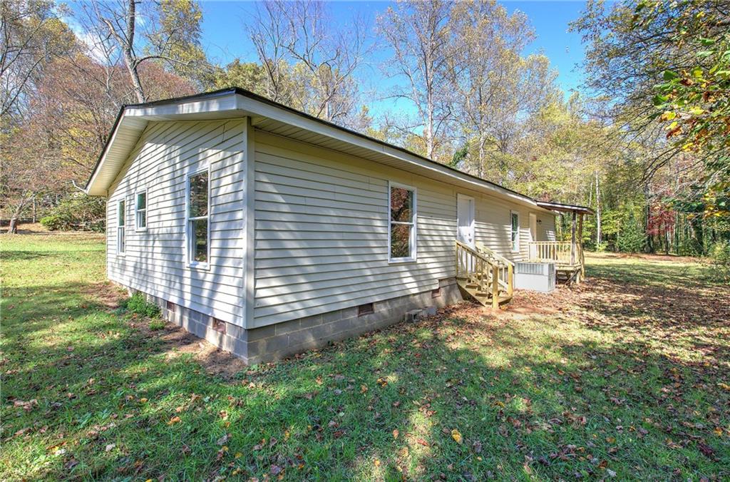 76 Morning Dew Lane Clayton, GA 30525 - Photo 25 of 28 a front view of a house with a yard
