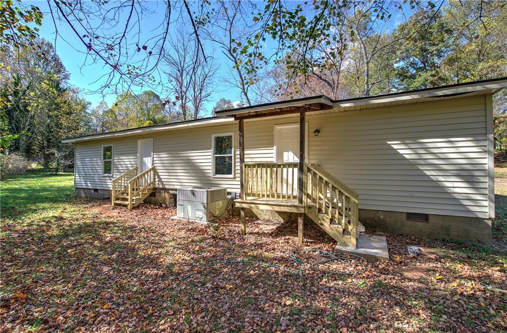 76 Morning Dew Lane Clayton, GA 30525 - Photo 27 of 28 a view of a house with backyard