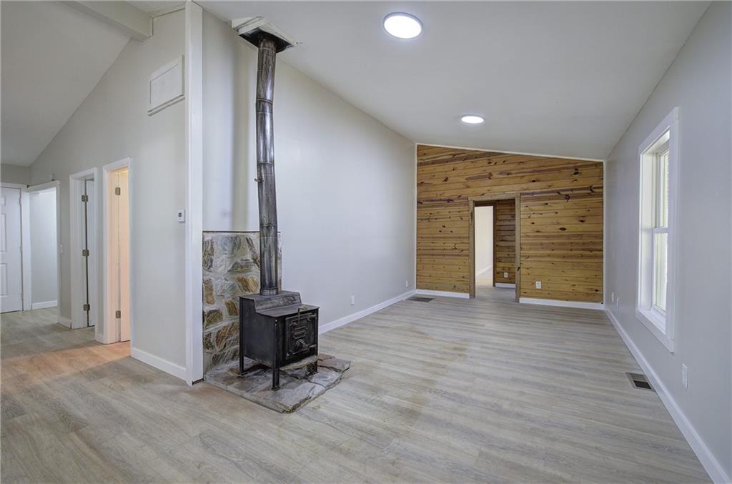 76 Morning Dew Lane Clayton, GA 30525 - Photo 3 of 28 a view of a livingroom with wooden floor and furniture