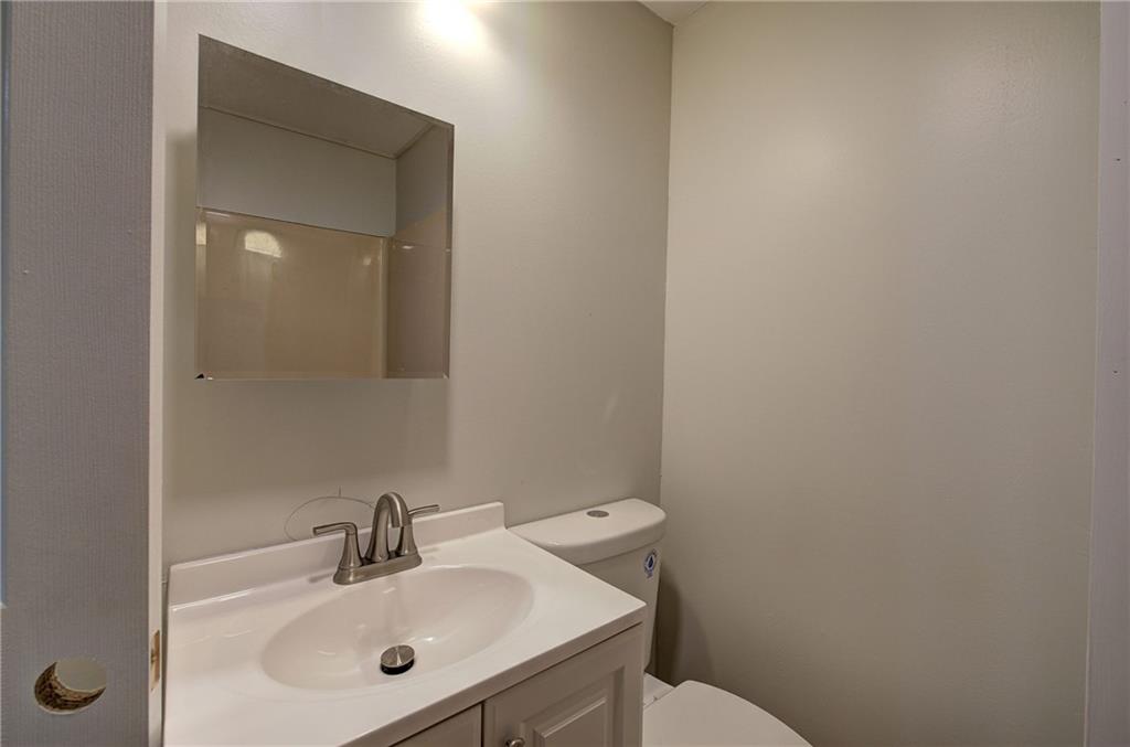 76 Morning Dew Lane Clayton, GA 30525 - Photo 9 of 28 a bathroom with a sink and a toilet