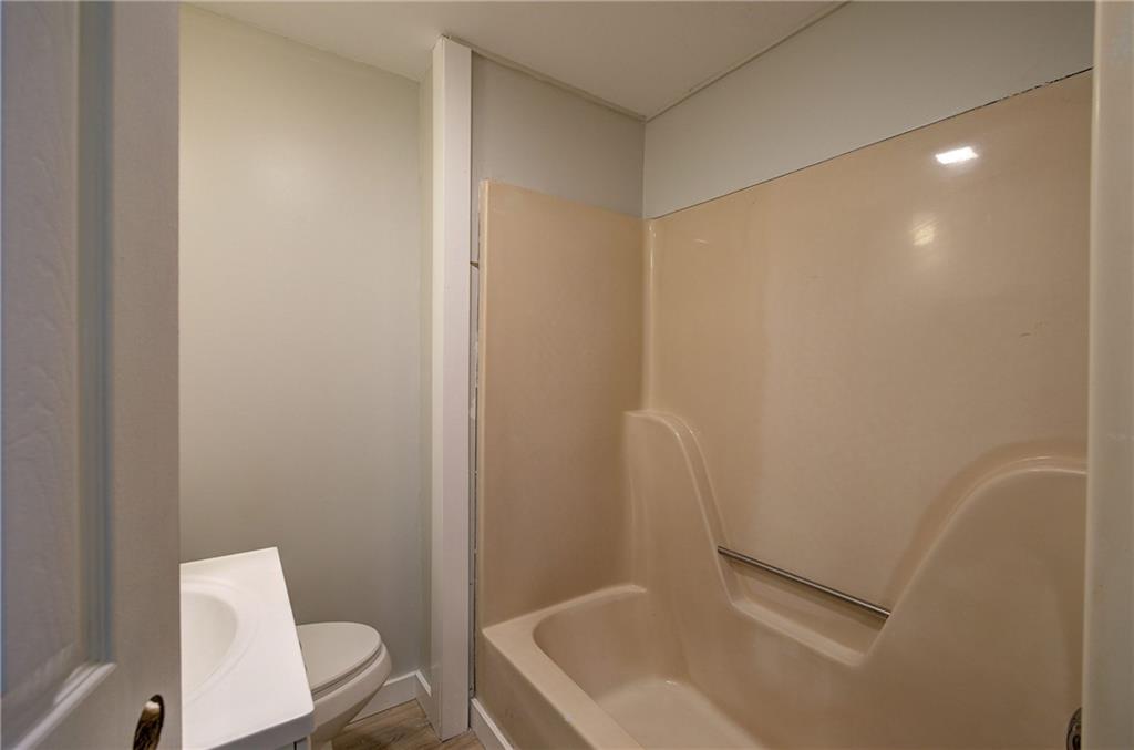 76 Morning Dew Lane Clayton, GA 30525 - Photo 10 of 28 a bathroom with a sink toilet and bathtub