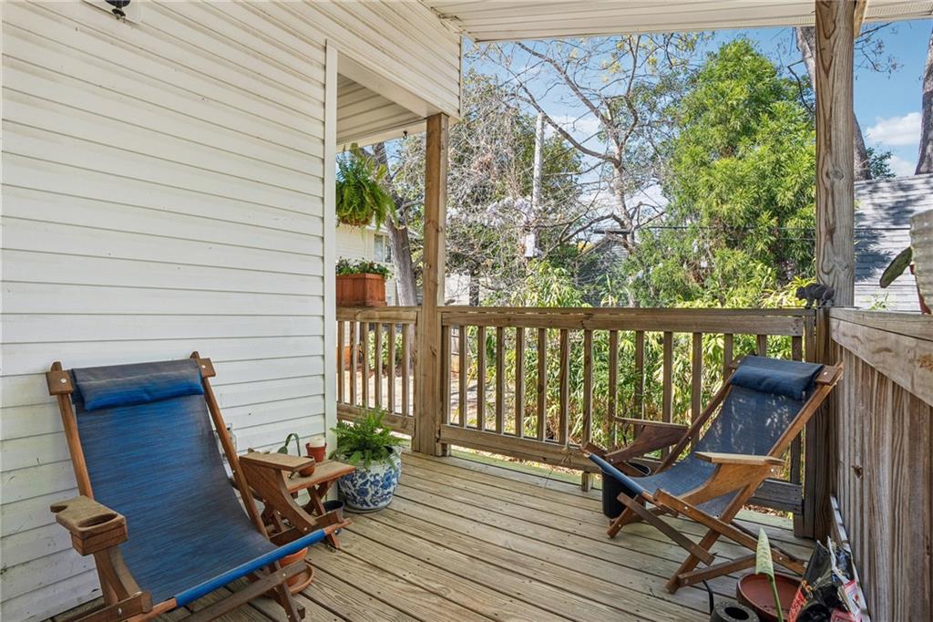 737 Barnett Street Northeast, Unit C4 Atlanta, GA 30306 - Photo 15 of 24 a balcony with wooden floor and outdoor seating