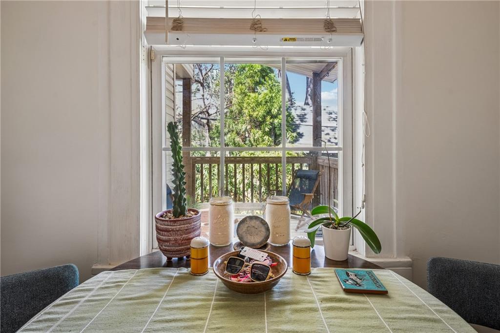 737 Barnett Street Northeast, Unit C4 Atlanta, GA 30306 - Photo 2 of 24 a living room with furniture and a large window
