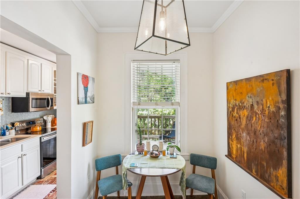 737 Barnett Street Northeast, Unit C4 Atlanta, GA 30306 - Photo 3 of 24 a view of a dining room with furniture window and outside view