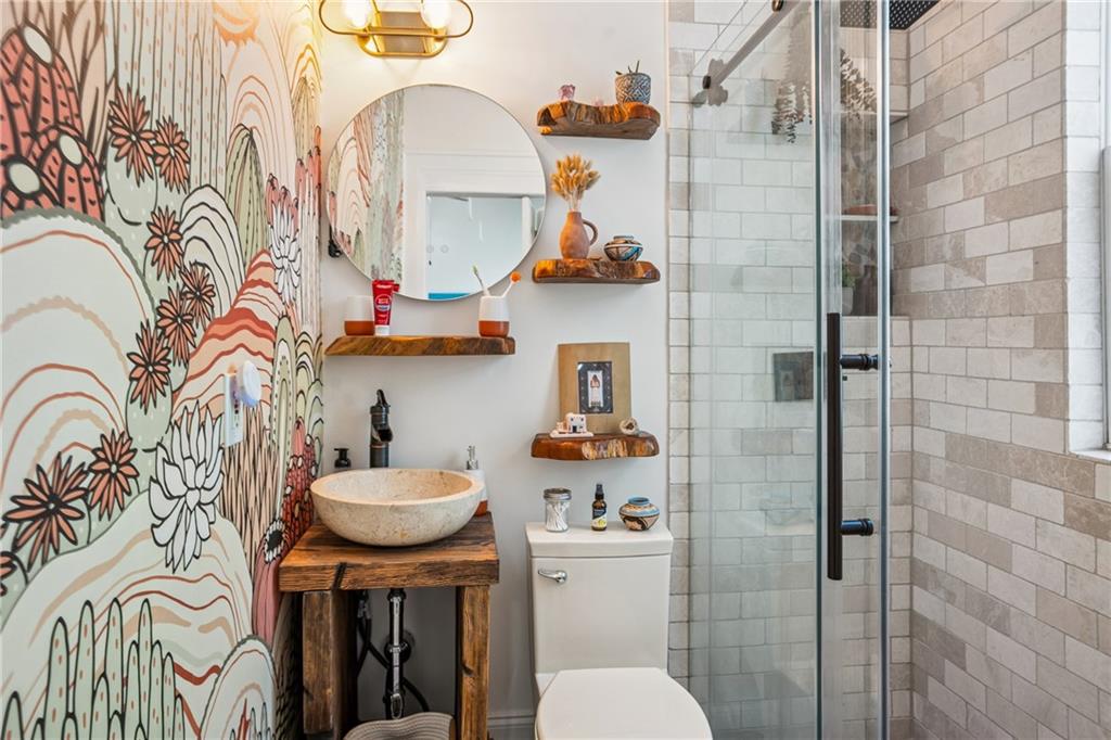 737 Barnett Street Northeast, Unit C4 Atlanta, GA 30306 - Photo 7 of 24 a bathroom with a sink toilet and shower