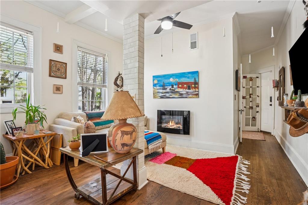 737 Barnett Street Northeast, Unit C4 Atlanta, GA 30306 - Photo 9 of 24 a living room with furniture a flat screen tv and a fireplace