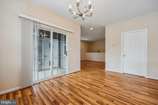 a front view of a residential apartment building with a yard