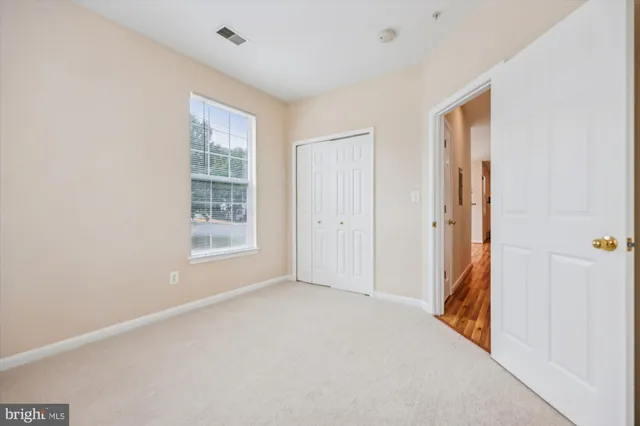 a bathroom with a granite countertop sink toilet a large mirror a bathtub and shower