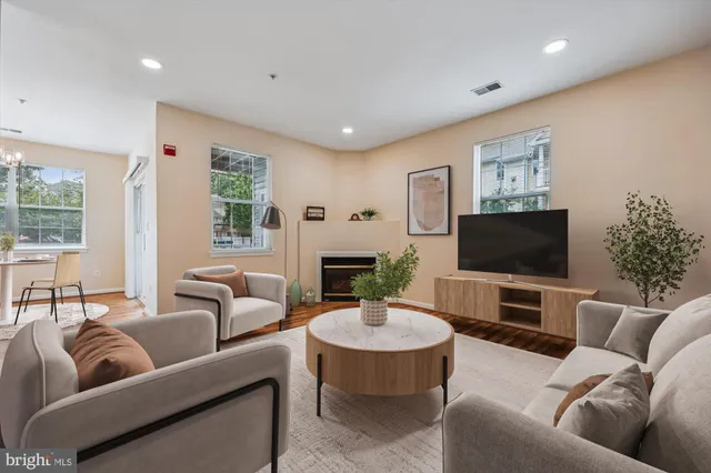a kitchen with stainless steel appliances a refrigerator sink and microwave